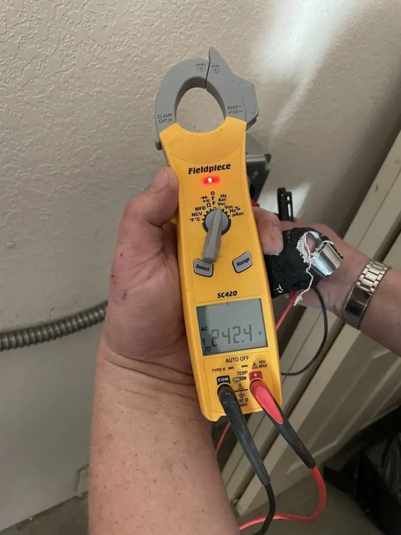 Voltage testing with clamp meter during Ceiling Fan Installation in Totowa